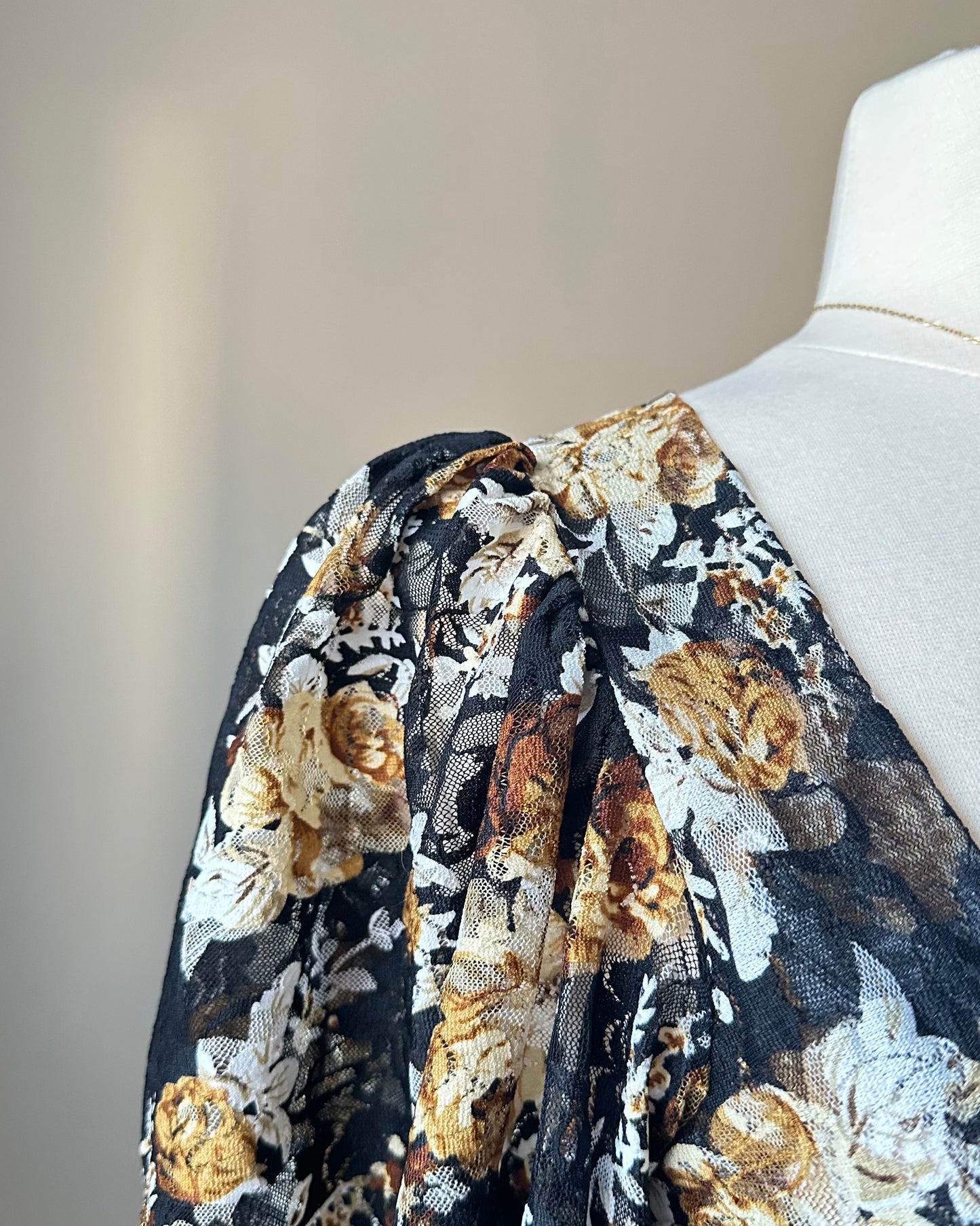 Unique Bodysuit featuring Sheer Black Fabric and Floral Patterned Sleeves