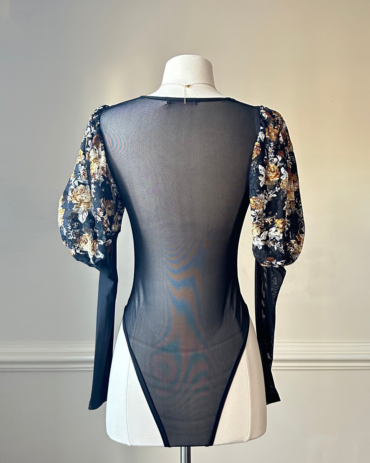 Unique Bodysuit featuring Sheer Black Fabric and Floral Patterned Sleeves