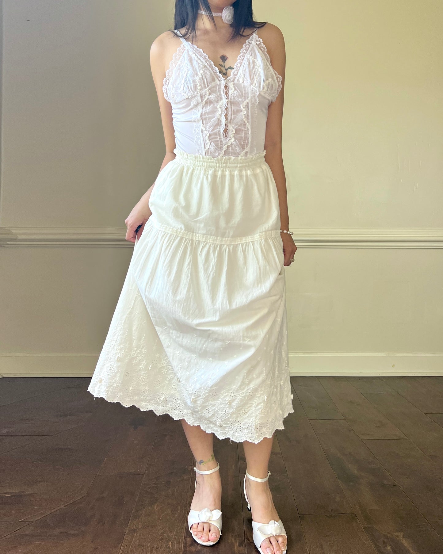 Angelic Laced Bodysuit featuring satin Lace Crisscross Detail with Ruffled Skirt Fringe