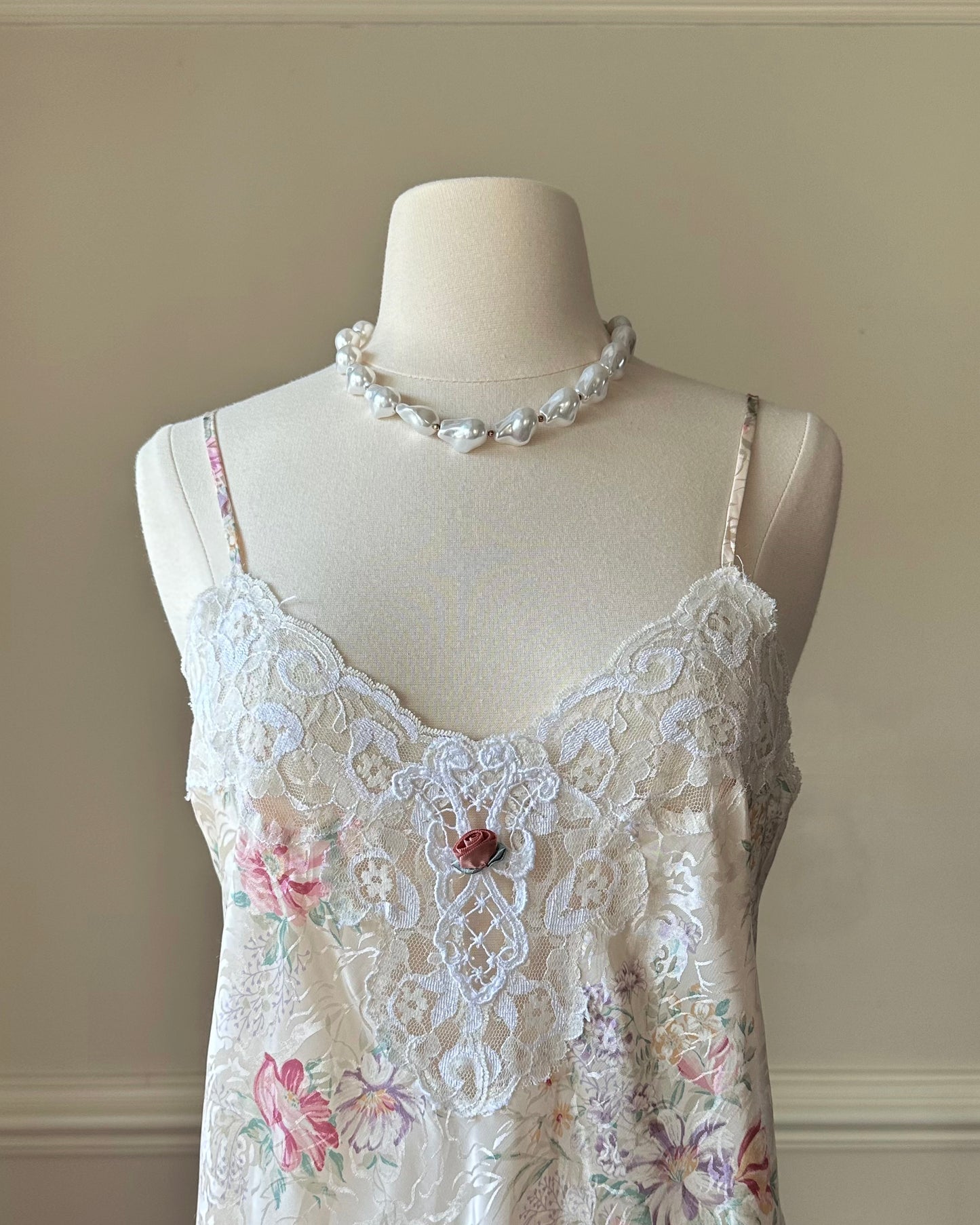 Vintage ivory satin slip dress with a bold pastel floral print