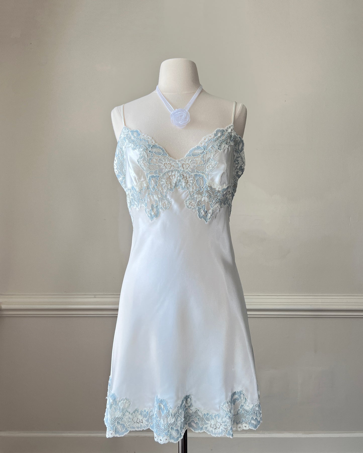 Vintage Victoria’s Secret ivory satin mini slip with blue lace