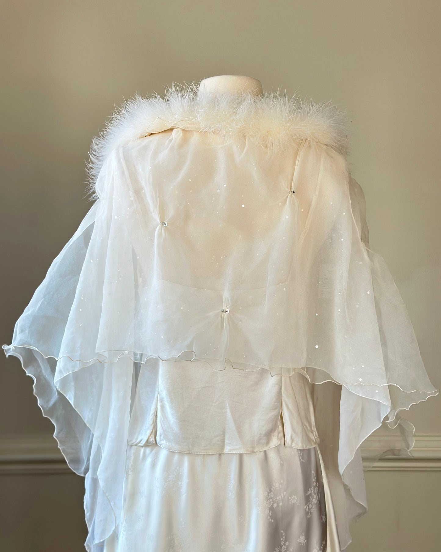 Ethereal fairy sheer poncho featuring reflecting specks on sheer mesh fabric