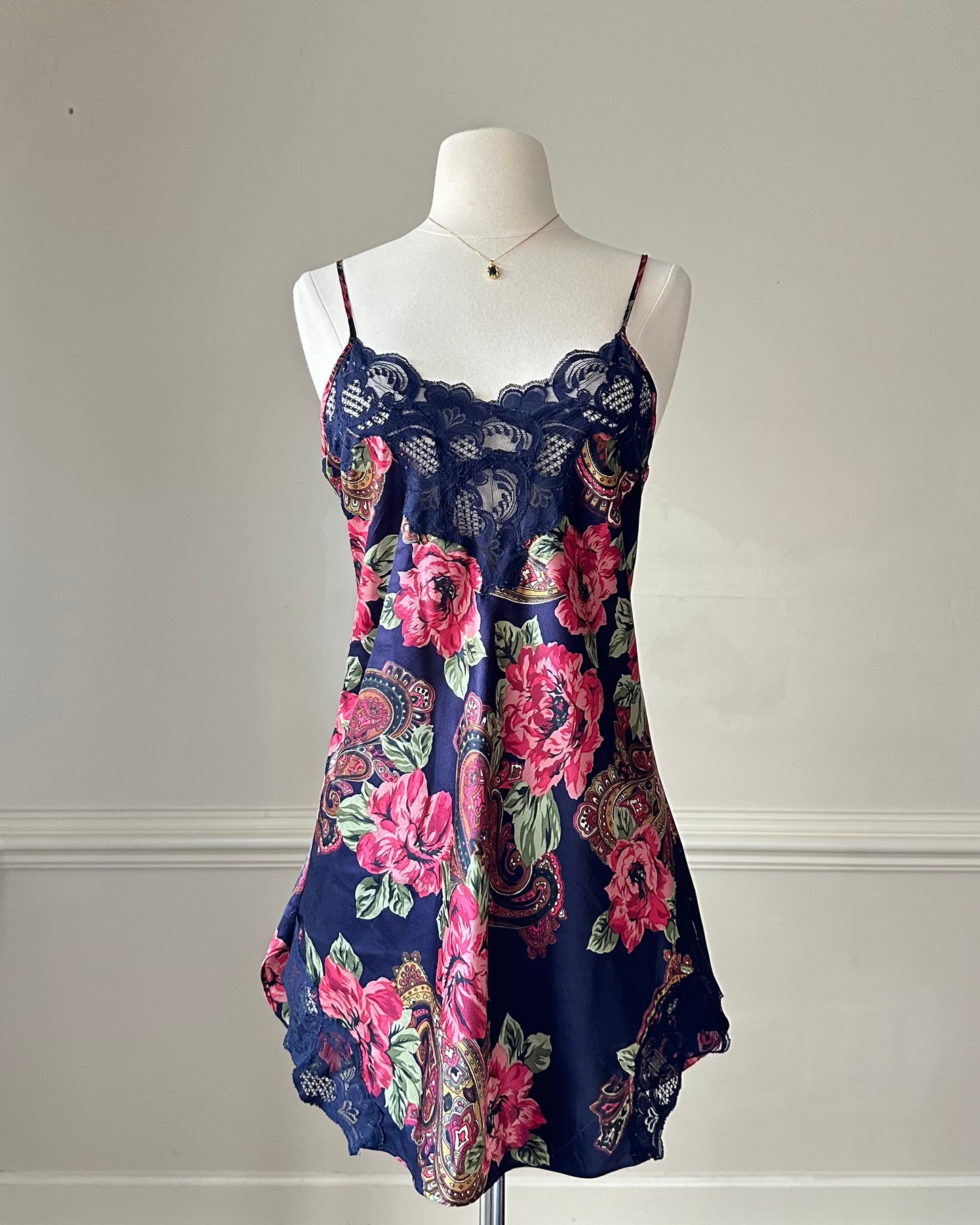 Dark navy satin dress featuring overlapping paisley and flower pattern