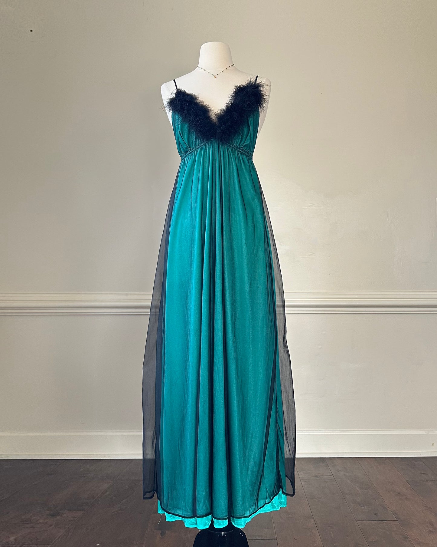 Emerald green maxi dress featuring sheer black mesh layout