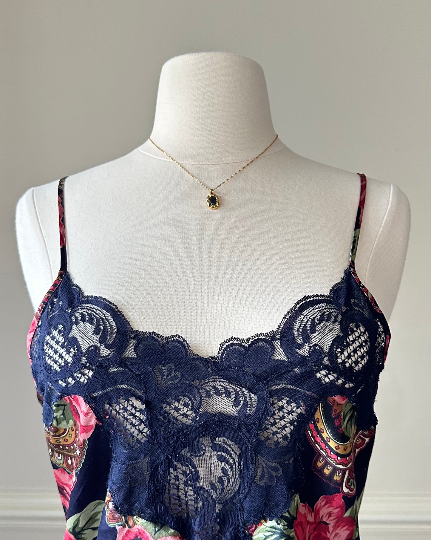 Dark navy satin dress featuring overlapping paisley and flower pattern