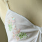 Victoria’s Secret sheer white open top featuring flower bouquets embroidery