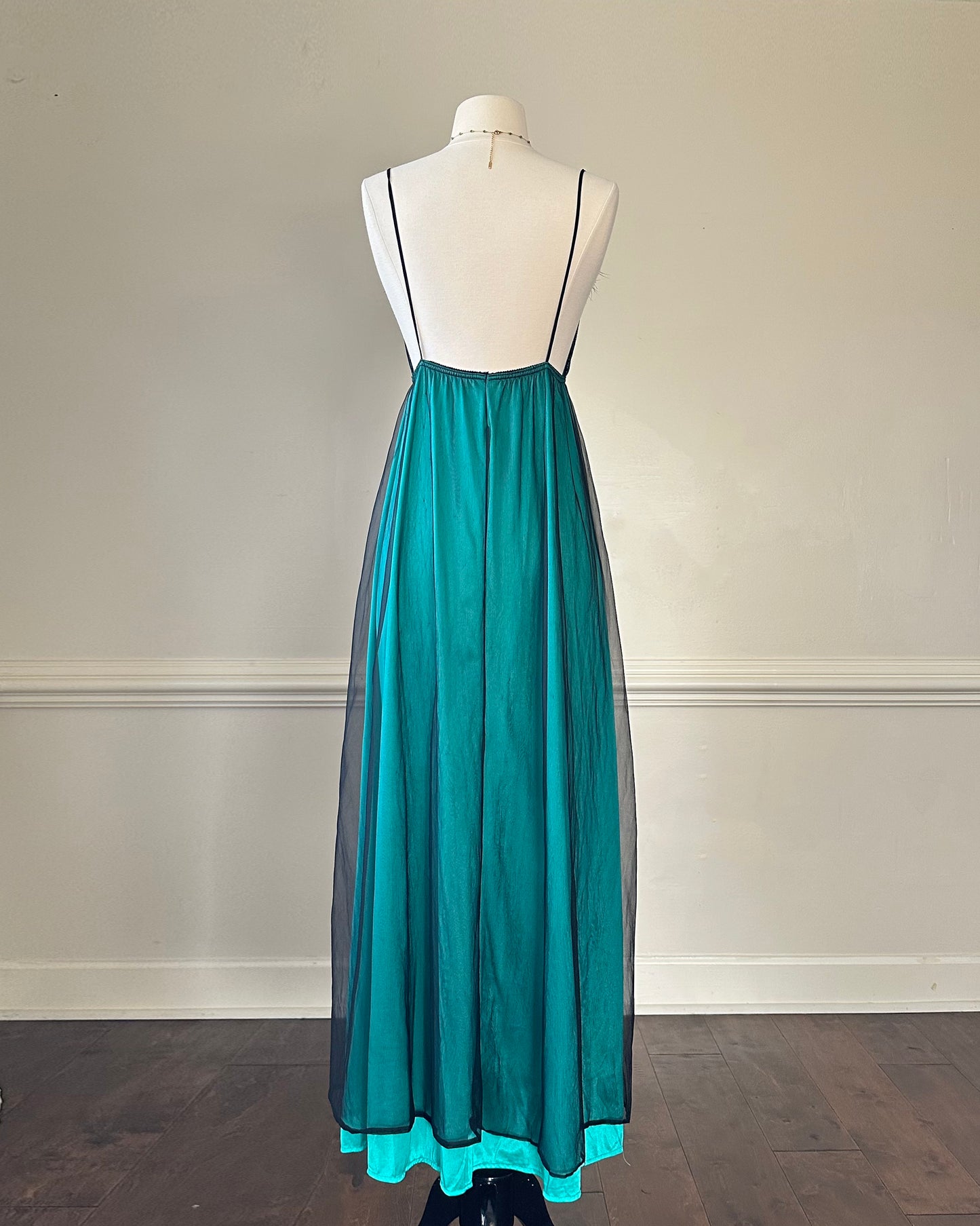 Emerald green maxi dress featuring sheer black mesh layout