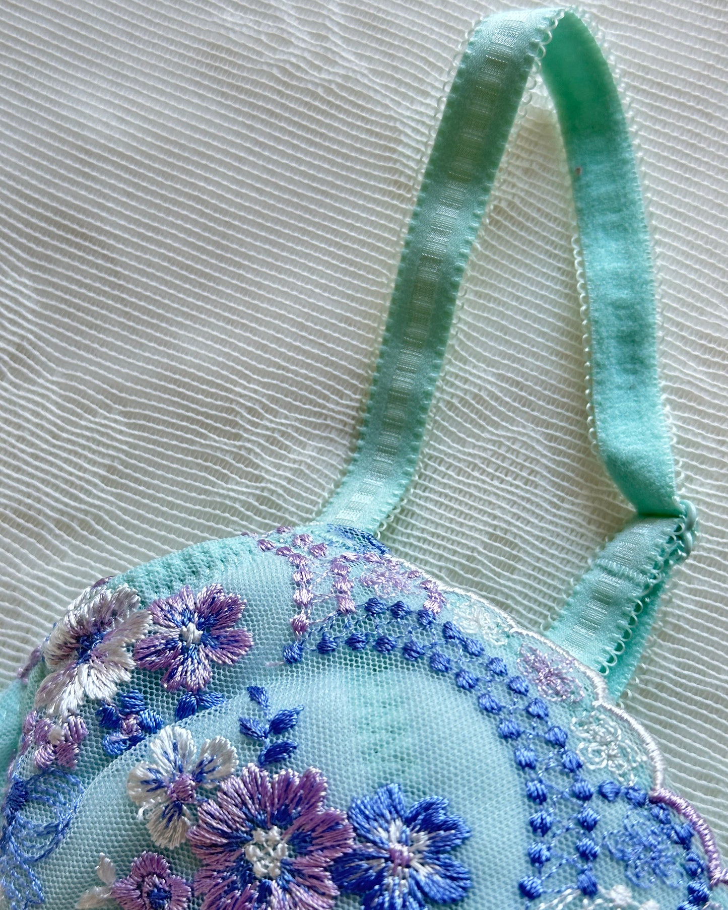 Turquoise blue Japanese brassiere featuring blue and lavender petite flowers embroidery