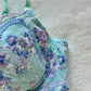 Turquoise blue Japanese brassiere featuring blue and lavender petite flowers embroidery