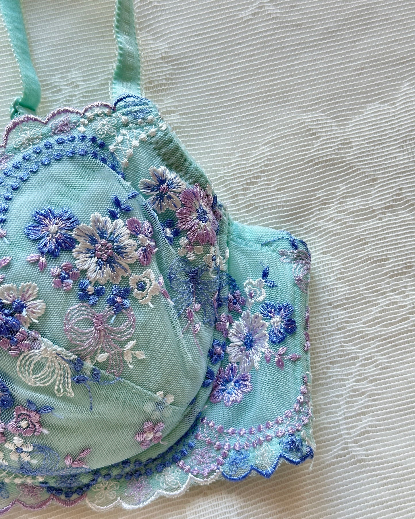 Turquoise blue Japanese brassiere featuring blue and lavender petite flowers embroidery