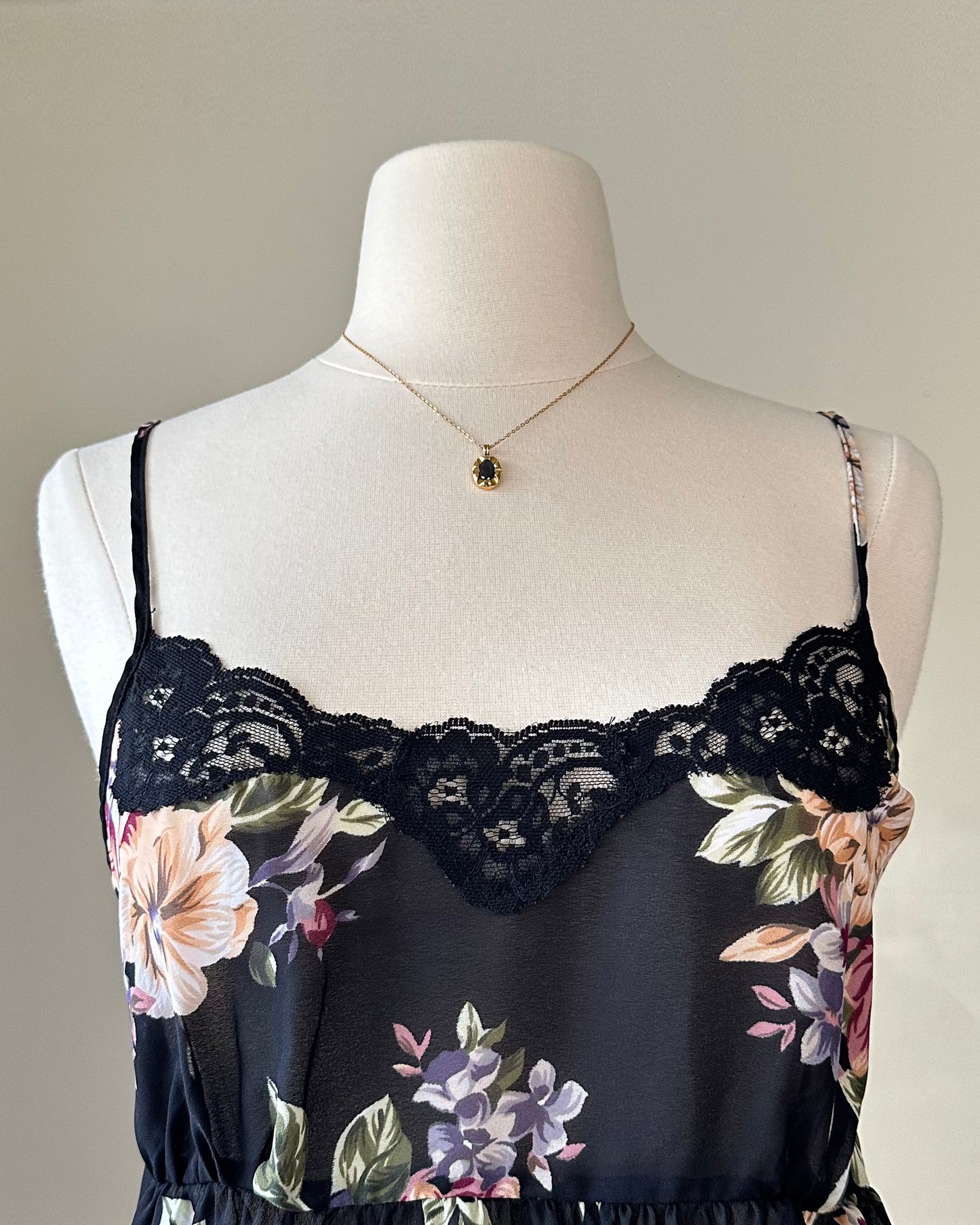 Valmode semi sheer black slip dress featuring vibrant peonies print