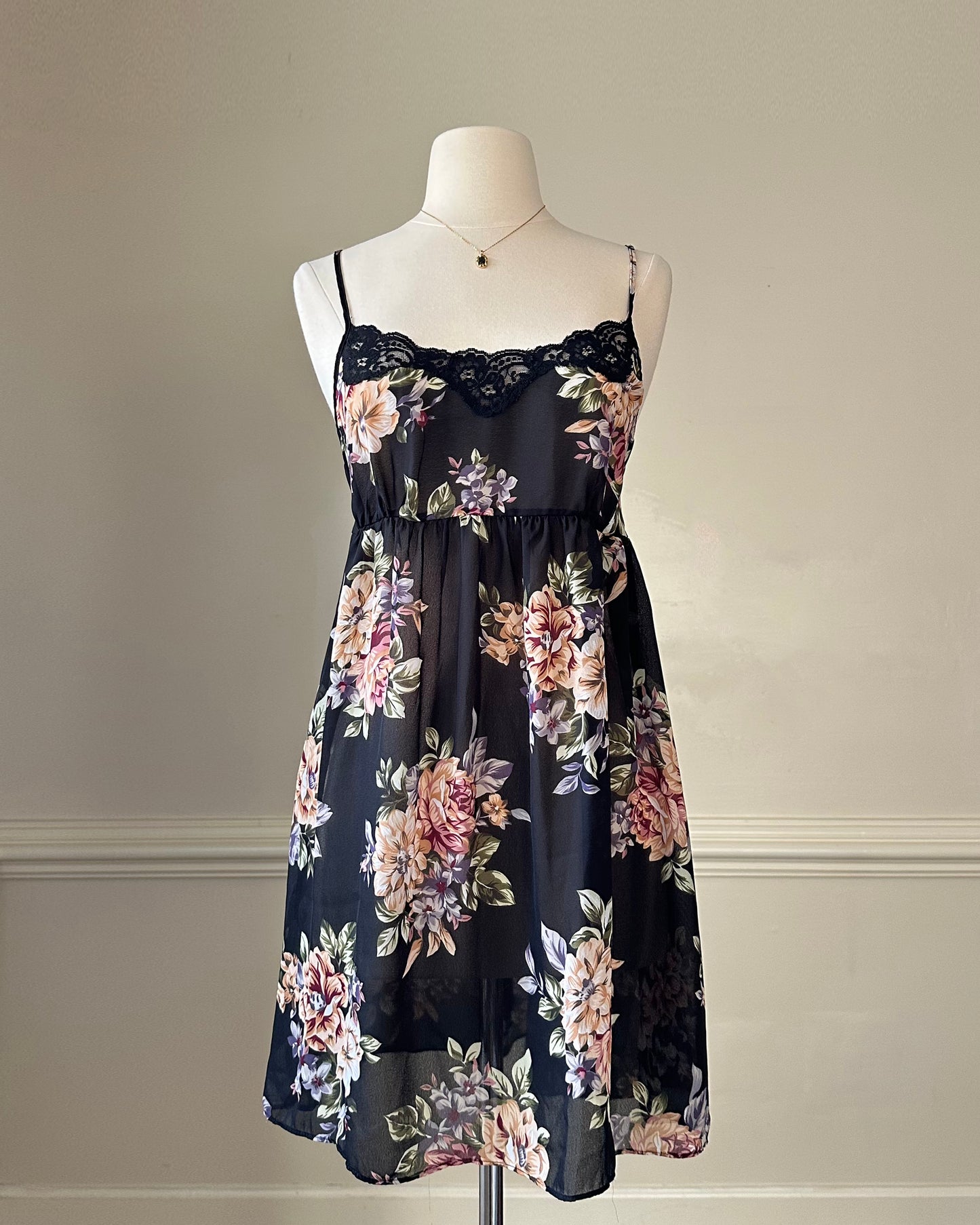 Valmode semi sheer black slip dress featuring vibrant peonies print