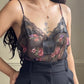 Flirty sheer black bodysuit featuring rose bouquets print with flared hips