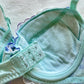 Turquoise blue Japanese brassiere featuring blue and lavender petite flowers embroidery