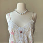 Vintage ivory satin slip dress with a bold pastel floral print