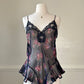 Flirty sheer black bodysuit featuring rose bouquets print with flared hips