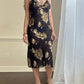 Sultry sheer black slip dress featuring golden blooming flowers print