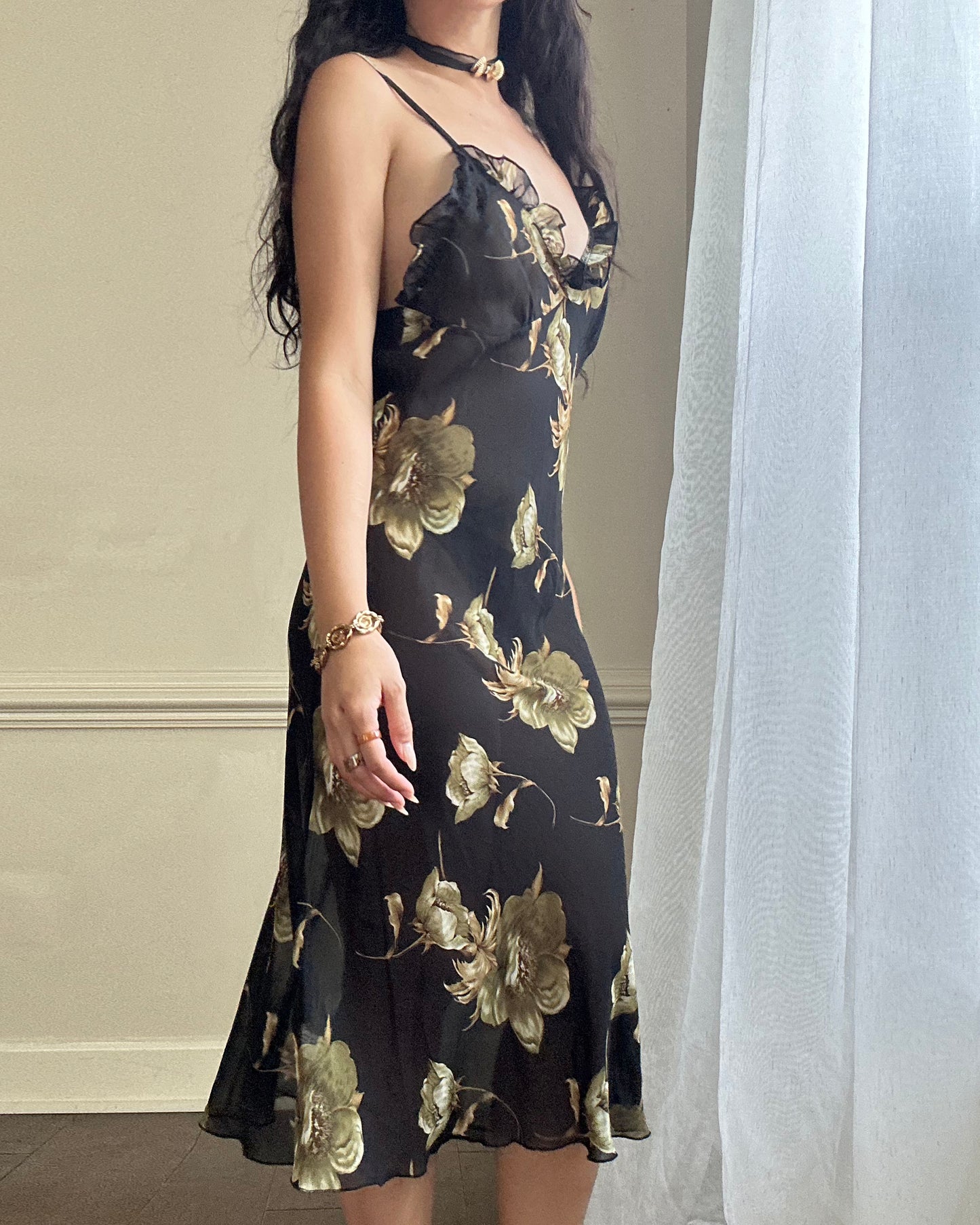 Sultry sheer black slip dress featuring golden blooming flowers print