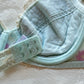 Baby blue Japanese brassiere featuring purple embroidered flowers