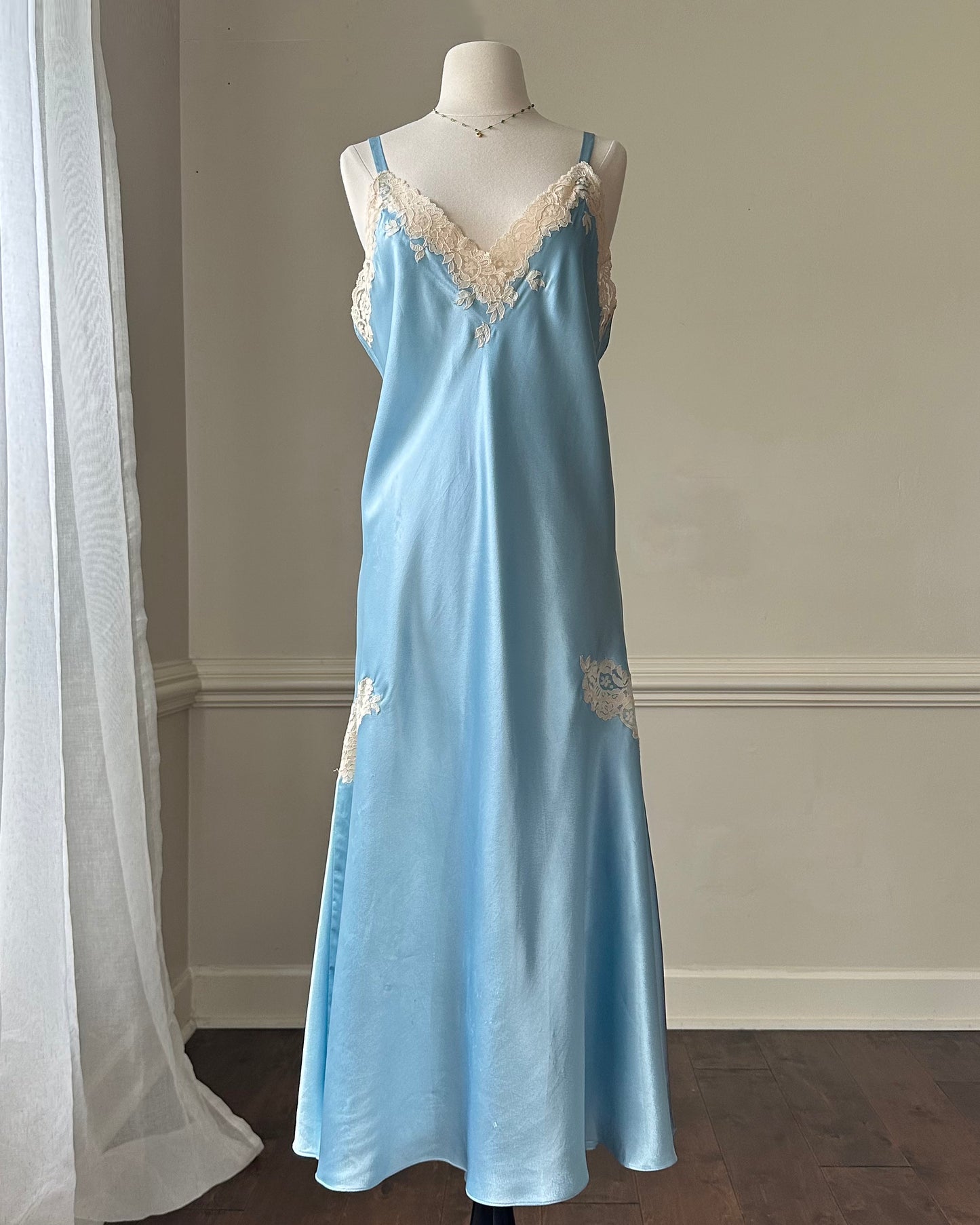 Ethereal sky blue satin maxi dress featuring rosettes embroidery bust