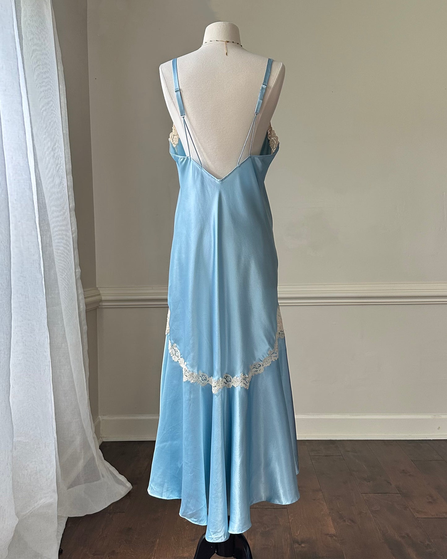 Ethereal sky blue satin maxi dress featuring rosettes embroidery bust