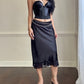 Sultry Midi Satin Skirt in Black featuring Floral Lace