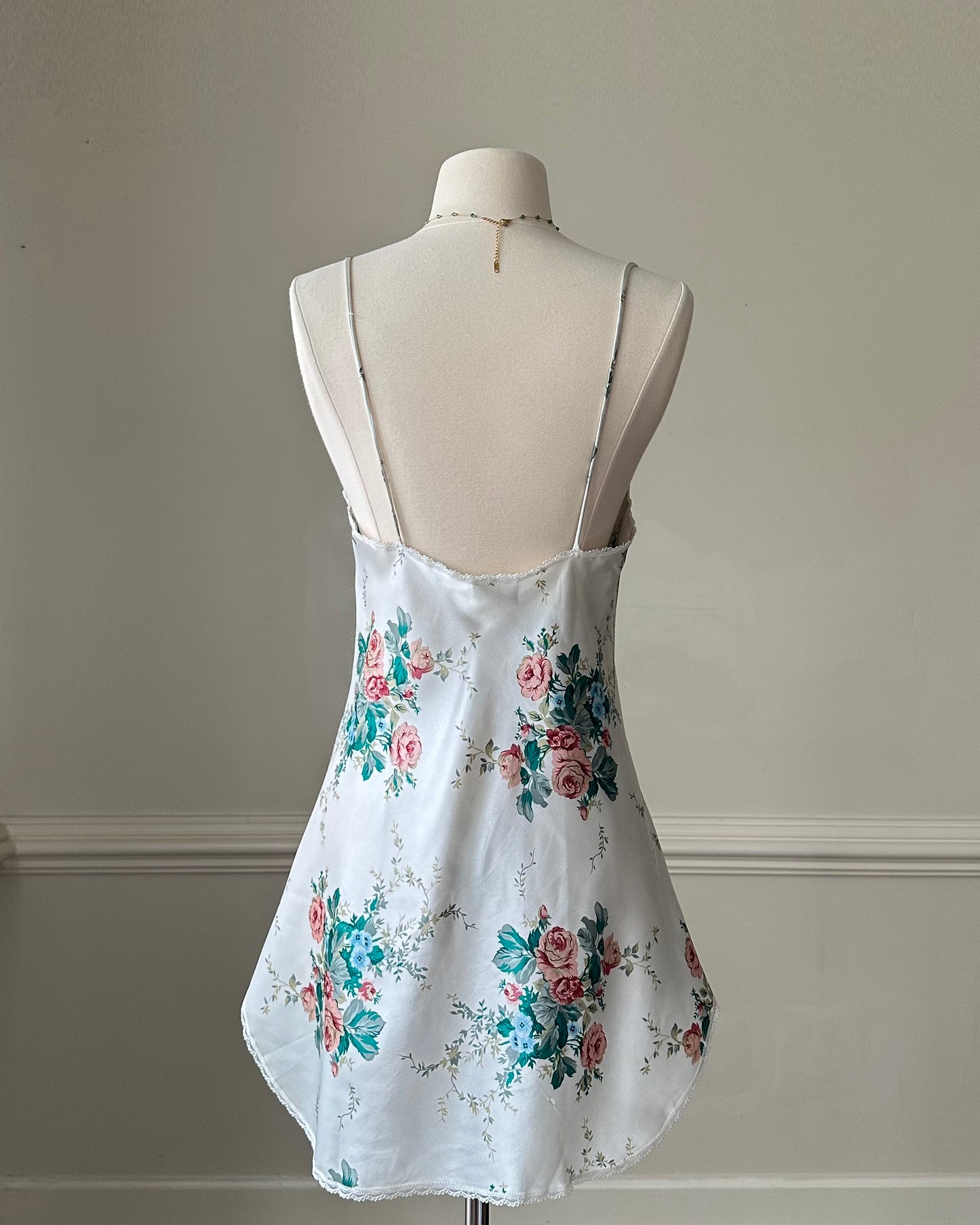 Vintage satin slip dress in white featuring bouquets of roses print