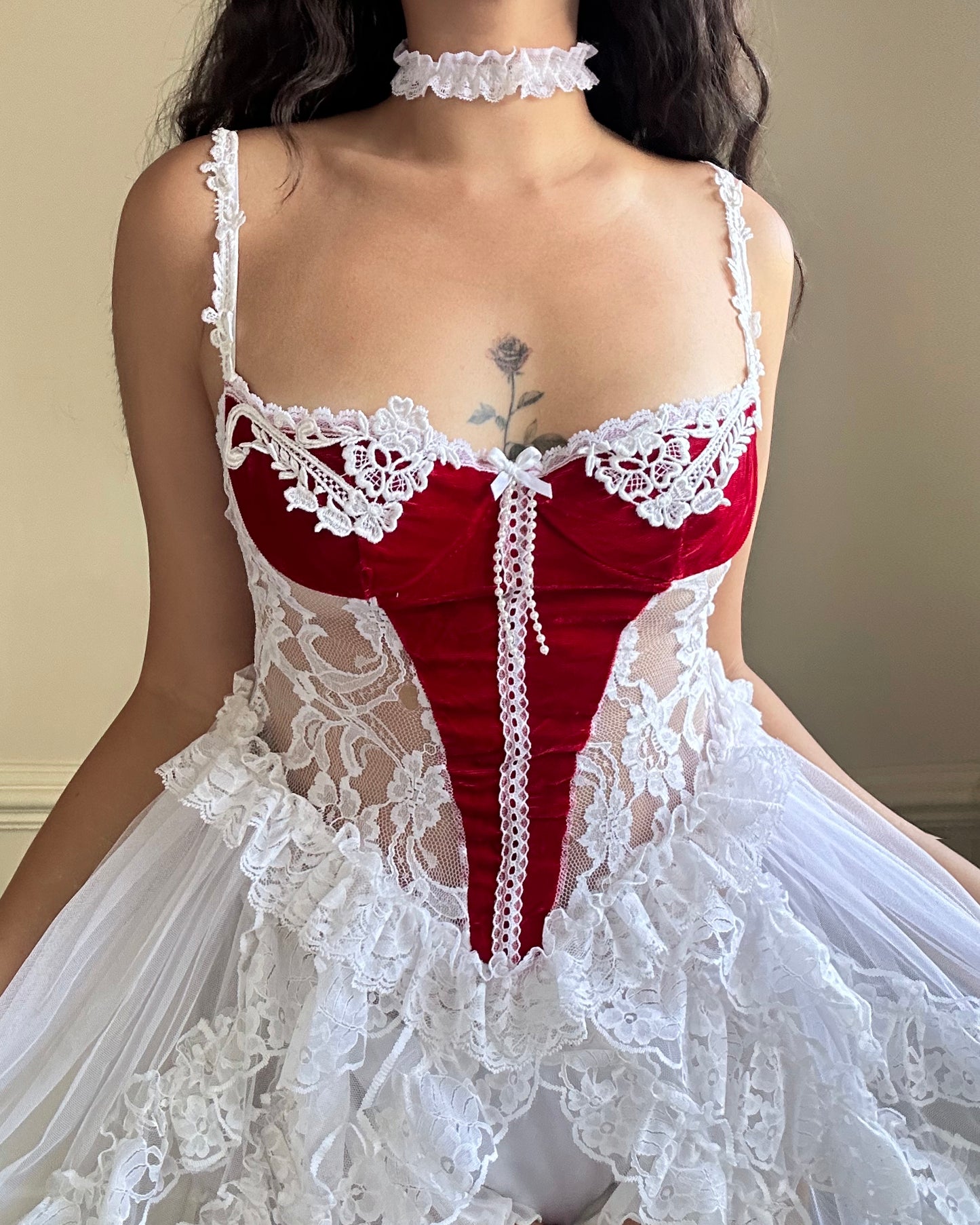 Frederick’s stunning bridal-inspired sheer slip dress featuring crimson red velvet bustier patch detail