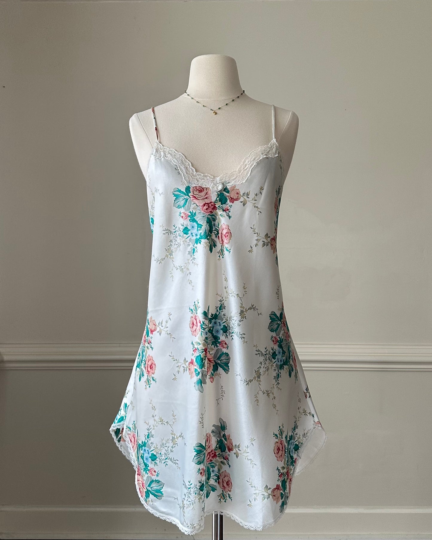 Vintage satin slip dress in white featuring bouquets of roses print