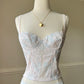 Vintage-inspired Pastel Corset featuring Rosette Embroidery Pattern